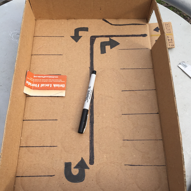 Box with business card for drawing parking space lines